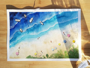 watercolour painting of a beach with tiny people and umbrella details